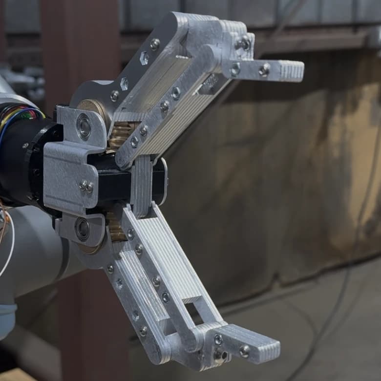 Metal Nibbler with its jaws fully open, showing the metal linkages and fingertips.